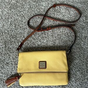Dooney and Bourke yellow Pebble Grain leather foldover crossbody